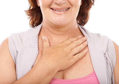 Buy stock photo Woman, care and hand on chest in support with empathy, kindness and wellness in white background. Studio, closeup and person gesture to heart, healthcare and smile for blood pressure and pulse