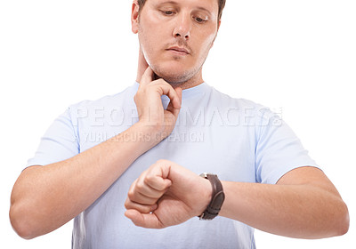 Buy stock photo Young man taking his heart rate against a white background
