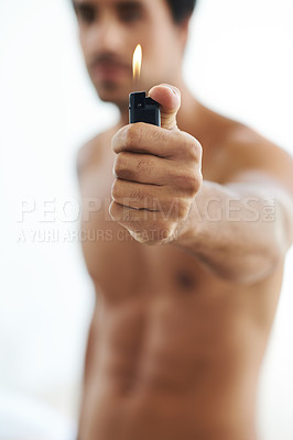 Buy stock photo Hand, lighter and fire with a man in studio on a white background for heat or flame closeup. Gas, glow and hot with the body of a shirtless person holding a burning light for orange and warmth