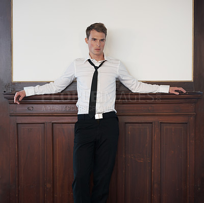 Buy stock photo Portrait of a handsome young man in a suit with copyspace behind him