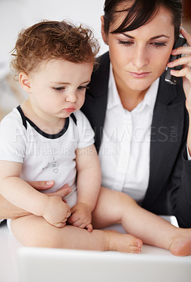 Buy stock photo Woman, home office and phone call with baby, laptop or care with talk, reading or multitasking at desk. Mother, young boy child and cellphone for networking, bond or remote work at pc in family house