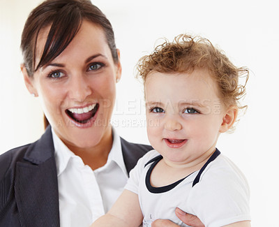 Buy stock photo Happy, baby and mom in portrait with business, work and motherhood with a professional career. Mockup, space and woman in a suit smile with love, care and playing with child in home or morning
