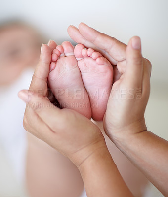 Buy stock photo Love, mother and hands with newborn or feet for development, nurture and bonding in nursery of apartment. Family, woman or baby toes with trust, support or care for relationship or motherhood in home
