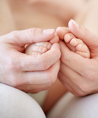 Buy stock photo Love, mother and hands with baby or feet for development, nurture and bonding in nursery of apartment. Family, woman or newborn toes with trust, support or care for relationship or motherhood in home