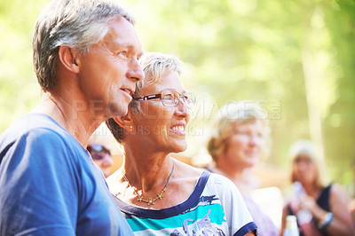 Buy stock photo Mature couple looking away together while outdoors