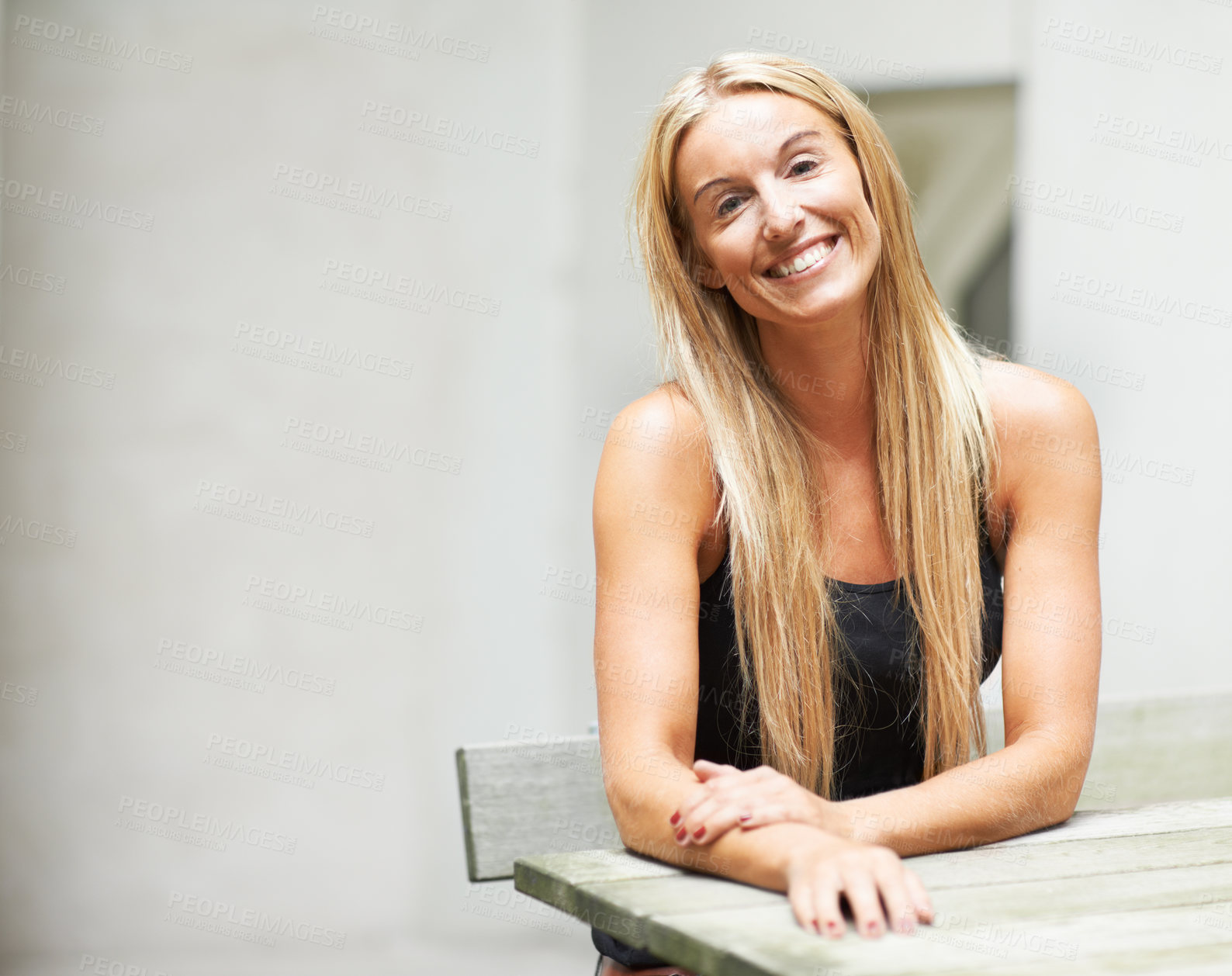 Buy stock photo Portrait of a confident young blond woman smiling