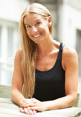 Buy stock photo Portrait of a confident young blond woman smiling