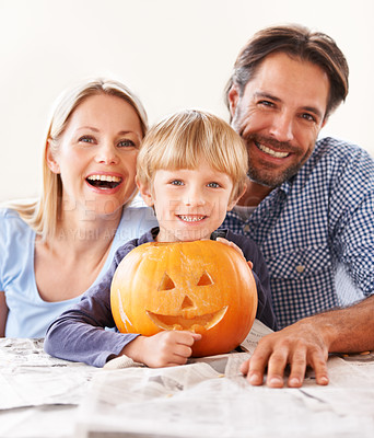 Buy stock photo Portrait, parents and kid with pumpkin for halloween to celebrate with fun together. Happy family, mom and dad with boy child carving face in vegetable for holiday lantern, decoration and party 