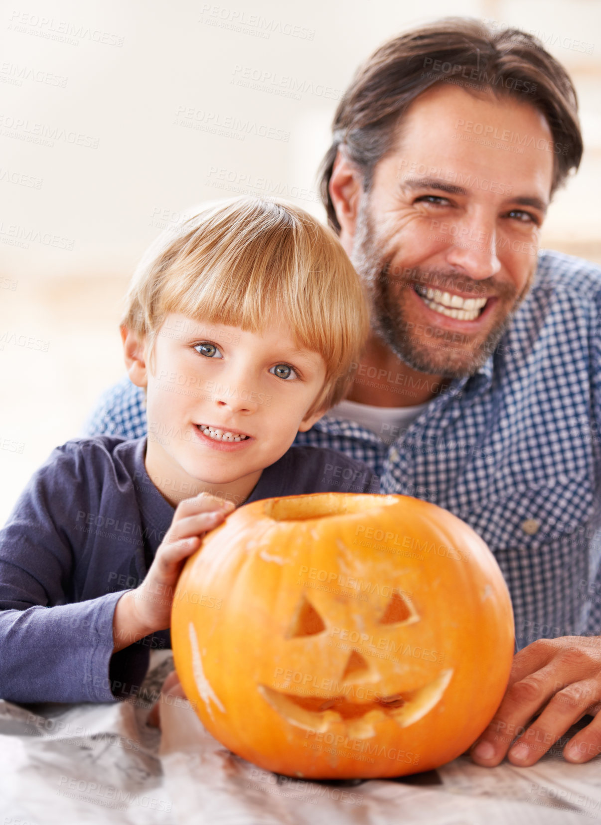 Buy stock photo Father, portrait and kid with pumpkin to celebrate halloween, fun craft and creativity at home. Happy boy child, dad and family carving face in orange vegetable, holiday lantern and party decoration 
