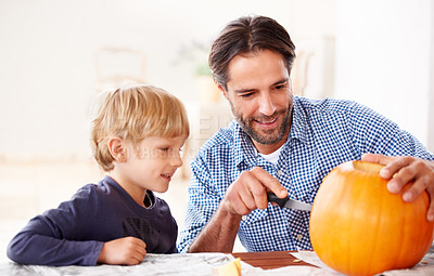 Buy stock photo Father, child and carving pumpkin with knife to celebrate halloween, fun craft and creativity at home. Happy boy kid, dad and family cutting orange vegetable for holiday lantern, party and decoration