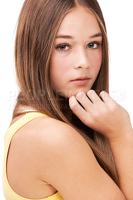 Buy stock photo Studio portrait of a teen girl with her hand on her chin isolated on white