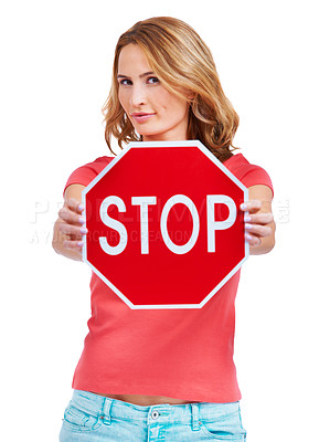 Buy stock photo A young woman holding a stop sign against a white background
