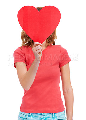 Buy stock photo A young woman holding a heart-shaped placard over her face while isolated on white