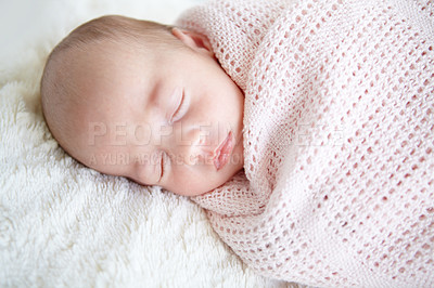 Buy stock photo A beautiful infant girl sleeping while wrapped up in a blanket