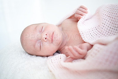 Buy stock photo A beautiful infant girl sleeping while wrapped up in a blanket