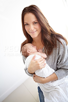 Buy stock photo Mother, portrait and holding newborn in family home with love, happiness or care with smile. Young mom, infant child or baby with happy bonding, pride or hug together with blanket in morning at house