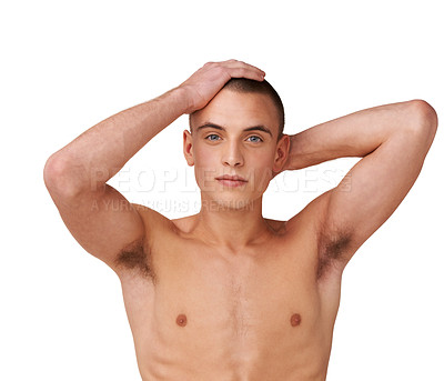 Buy stock photo Shot of a handsome young man posing shirtless