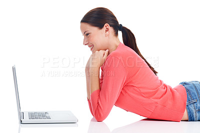 Buy stock photo Laptop, studio floor and happy woman watch comedy movie, internet meme or streaming social media video. Digital website, relax model smile and profile girl reading comic isolated on white background