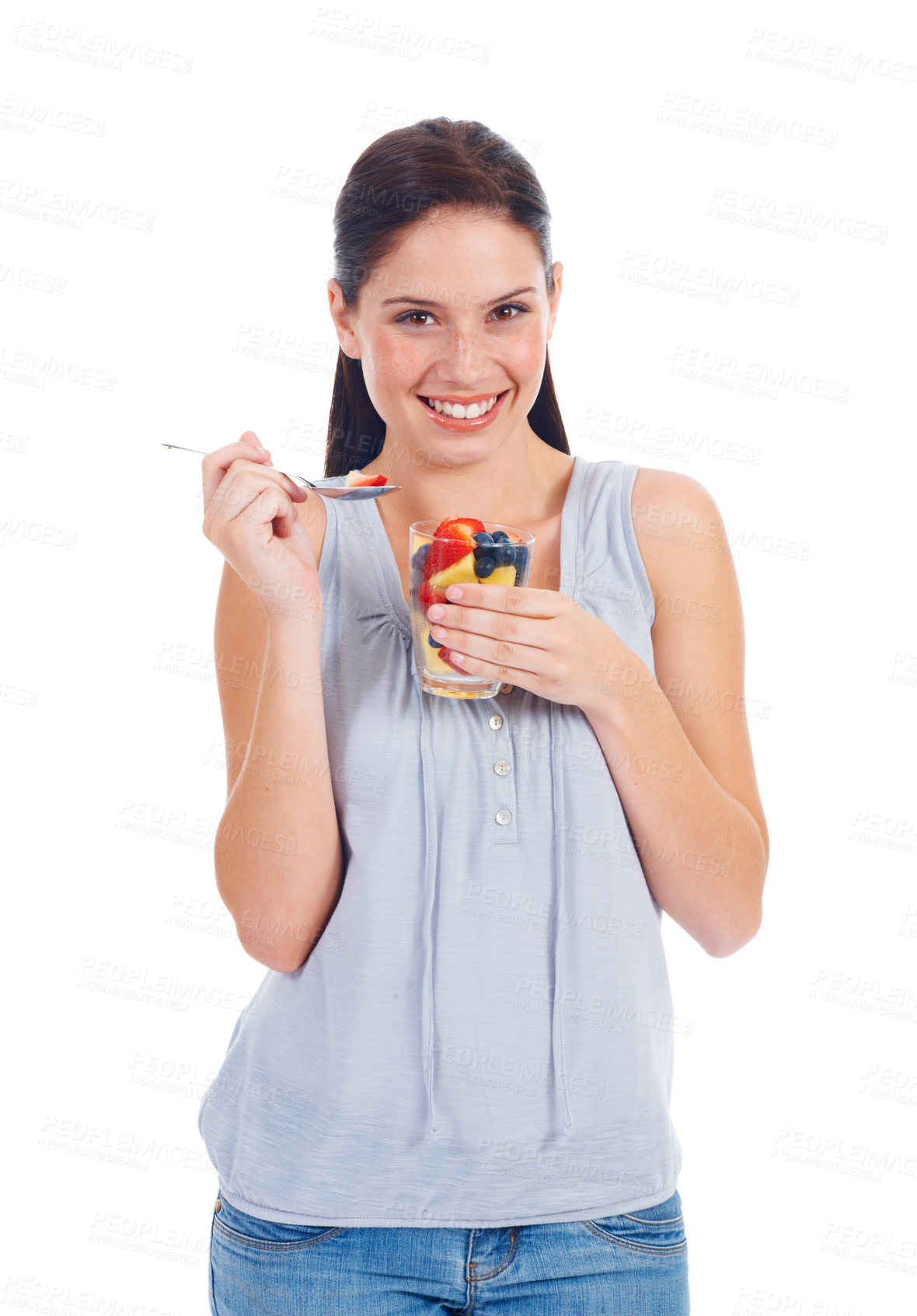 Buy stock photo Happy portrait, woman and fruit salad glass for weight loss, health diet or body detox for wellness lifestyle. Vegan healthcare, nutritionist food and studio model eating isolated on white background