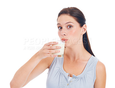 Buy stock photo Portrait, studio and woman drinks glass of milk for healthcare benefits, bone health or wellness hydration. Calcium dairy product, nutritionist face and model isolated on white background