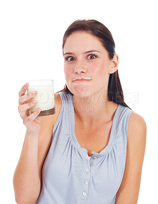 Buy stock photo Portrait, funny woman and glass of milk for vitamin D healthcare benefits, bone health or nutritionist hydration drink. Calcium dairy product, wellness and studio model isolated on white background