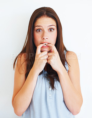 Buy stock photo Portrait, nervous and biting nails with a woman in studio isolated on a white background for psychology. Stress, anxiety and mental health with a scared young female person looking terrified in fear