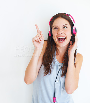 Buy stock photo Music headphones, pointing and happy woman listening to girl song, audio podcast or radio sound. Mockup gesture, studio freedom and excited model streaming edm playlist isolated on white background