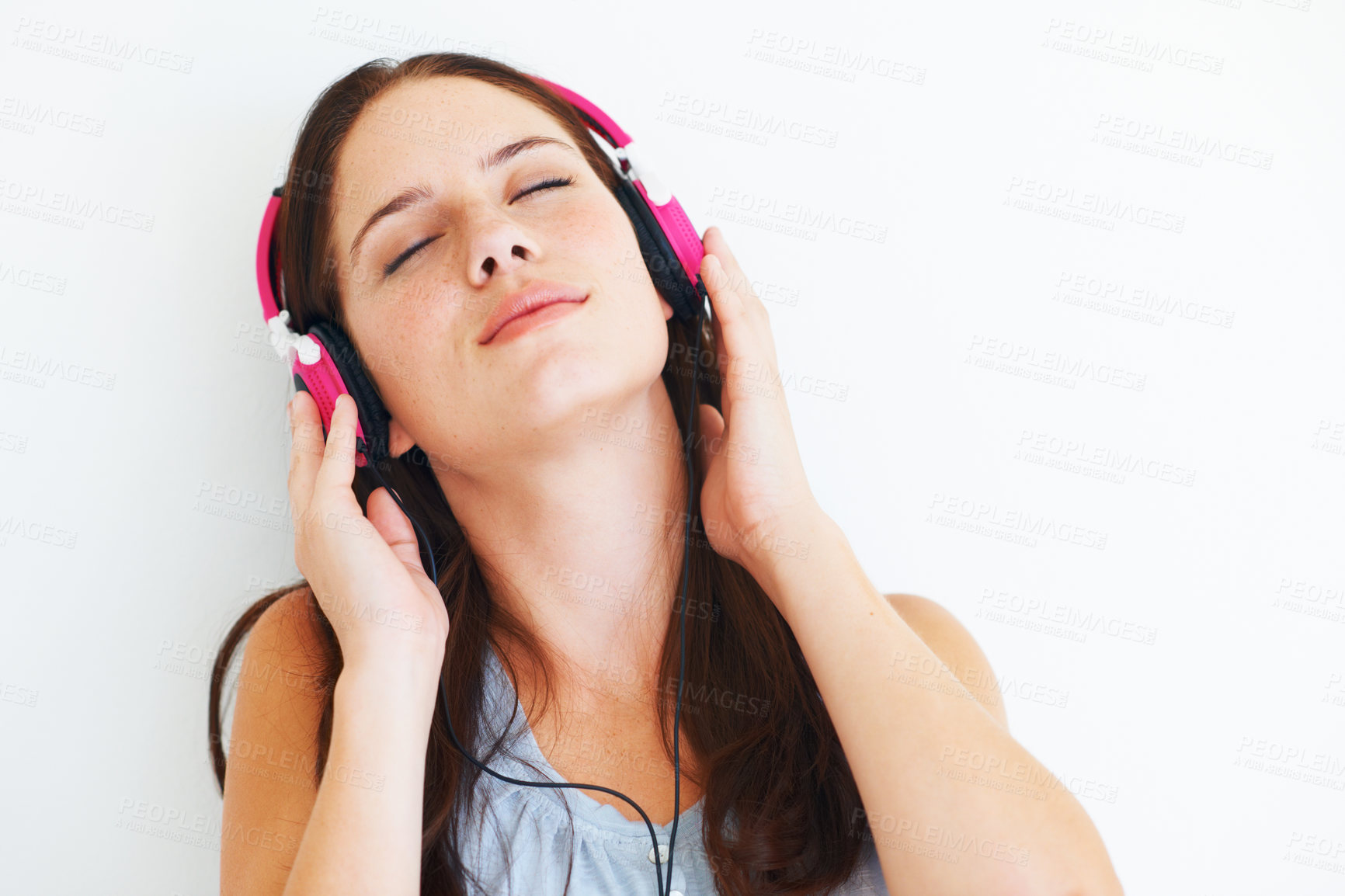 Buy stock photo Woman, peace and listening to music on headphones to relax with sound in white background of studio. Radio, podcast or person streaming a jazz, album or hear audio of song playing with technology