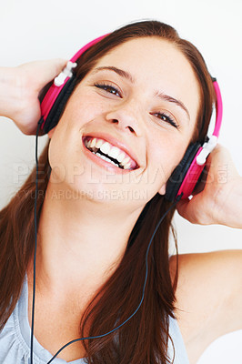 Buy stock photo Music headphones, happy face and woman portrait listening to fun girl song, wellness audio podcast or radio sound. Studio smile, freedom and model streaming edm playlist isolated on white background