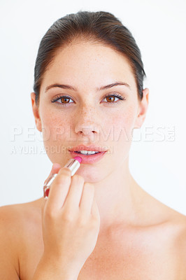 Buy stock photo Woman, face and portrait with lipstick for makeup, cosmetics or skincare isolated against a white studio background. Beautiful happy female applying cosmetic product on lips for beauty in self love