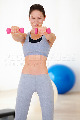 Buy stock photo Woman, training and portrait for dumbbells in studio for health wellness, fitness and weight loss with exercise. Young person, happy and face with hand weights for tone muscle with strong body in gym