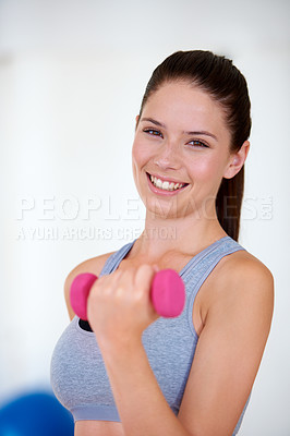 Buy stock photo Woman, sports bra and portrait with dumbbells in studio for health wellness, training and weight loss with exercise. Young person, happy and face with hand weights for tone muscle with fitness in gym