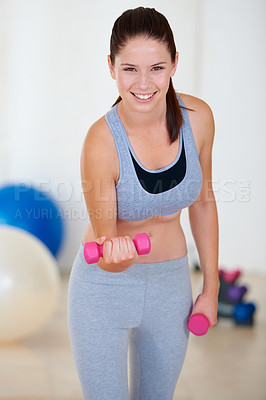 Buy stock photo Woman, flexing or portrait with dumbbells in gym, health glow or fitness for weight loss with exercise. Young person, happy and face with hand weights for training wellness in sports clothes