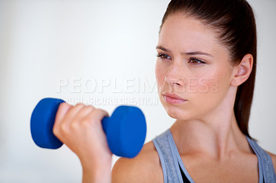 Buy stock photo Woman, serious and exercise with dumbbells in studio, health wellness and fitness for weight loss. Young person, thinking or commitment with workout for tone muscle or training on white background