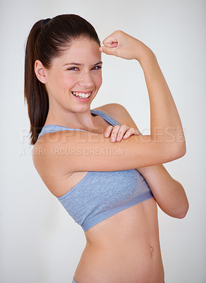 Buy stock photo Woman, portrait or smile in studio with flex for fitness, wellness or workout strength with sportswear. Person, athlete or happy for biceps, exercise and training on white background or mock up space