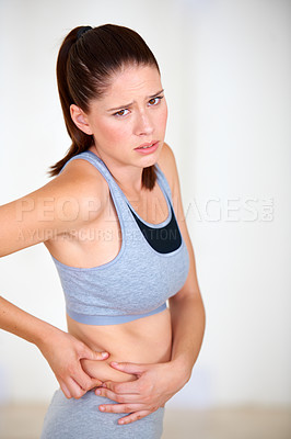 Buy stock photo Pinch, stomach and portrait of woman for fitness, exercise and workout to lose weight. Worry, sad and person holding skin or body fat for diet, liposuction and tummy tuck for wellness or health