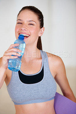 Buy stock photo Smile, fitness and portrait of woman drinking water for pilates workout or exercise in gym. Happy, sports and thirsty young female athlete enjoying hydration beverage for training at health class.