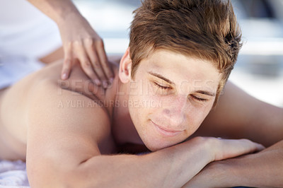 Buy stock photo Young man receiving a relaxing massage
