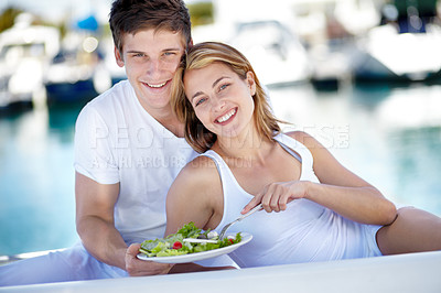 Buy stock photo Young couple enjoying a fresh salad together