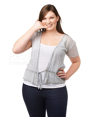 Buy stock photo Portrait, call me hand gesture and a plus size woman in studio isolated on a white background for communication. Smile, finger phone and a happy young person feeling body positive while flirting