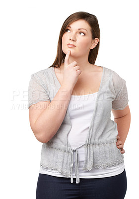 Buy stock photo A full-figured young woman looking away thoughtfully while isolated on white