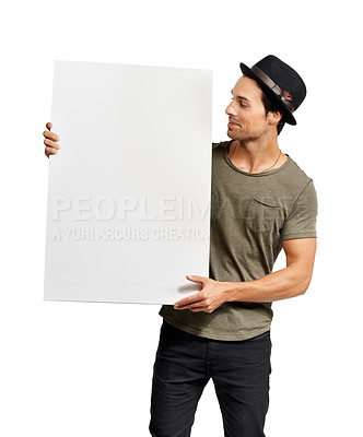 Buy stock photo Poster, mockup and information with a hipster man in studio isolated on a white background for marketing. Space, sign or placard with a confident young person holding a billboard for an announcement