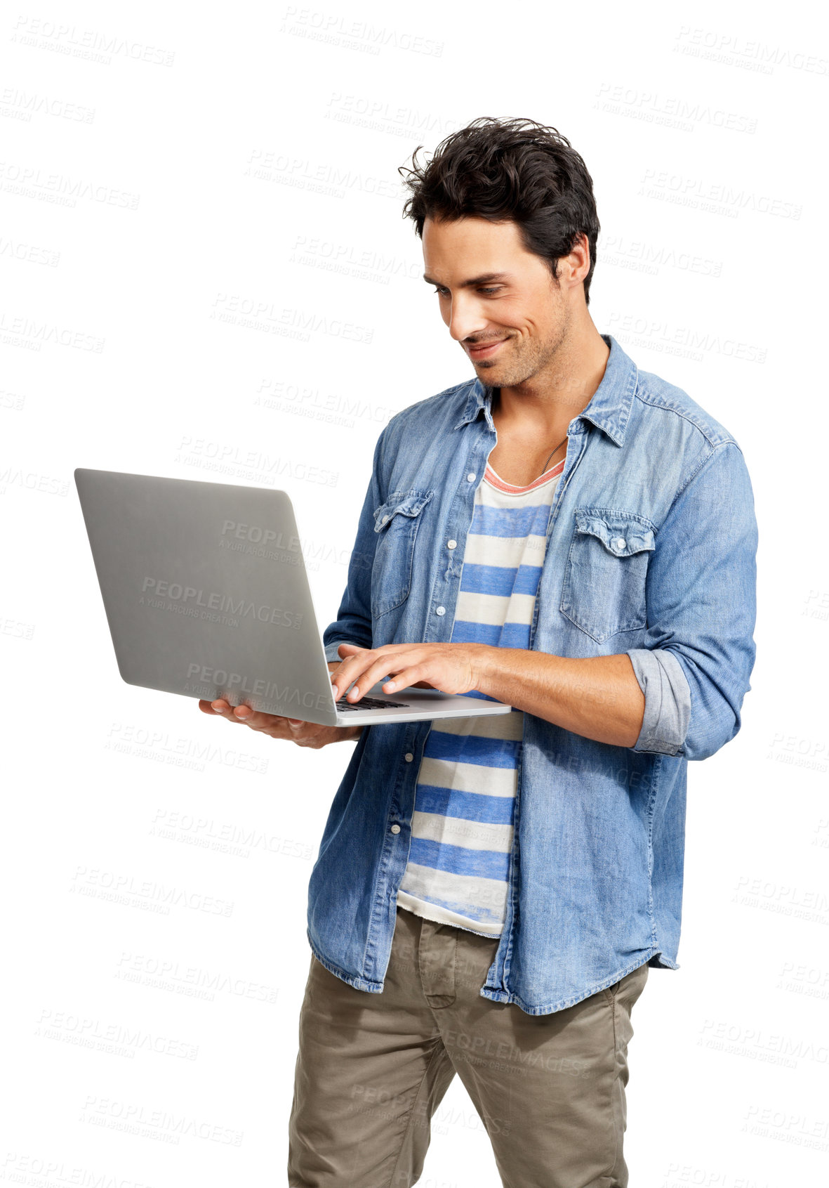 Buy stock photo A handsome young man working on his laptop against a white background