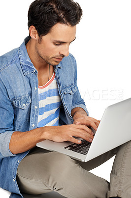 Buy stock photo Man, freelancer and typing on laptop, studio and networking with internet connection by white background. Male person, technology and website or email, online research and copywriting or blogging