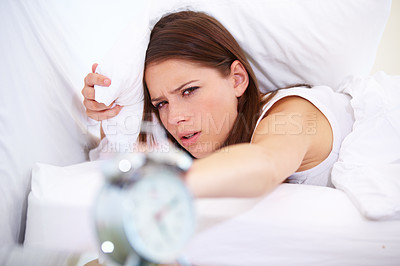 Buy stock photo Alarm, clock and angry woman in a bed frustrated with sound, alert or wake up noise at home. Time, stop and face of annoyed female person in bedroom with insomnia, crisis or snooze disaster in house