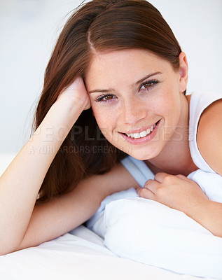 Buy stock photo Happy, beauty and portrait of woman on bed for relaxing with positive, good and confident attitude. Smile, calm and young female person from Canada laying and resting in bedroom of modern apartment.
