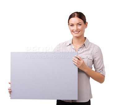 Buy stock photo Cropped shot of an attractive young woman holding a blank sign isolated on white