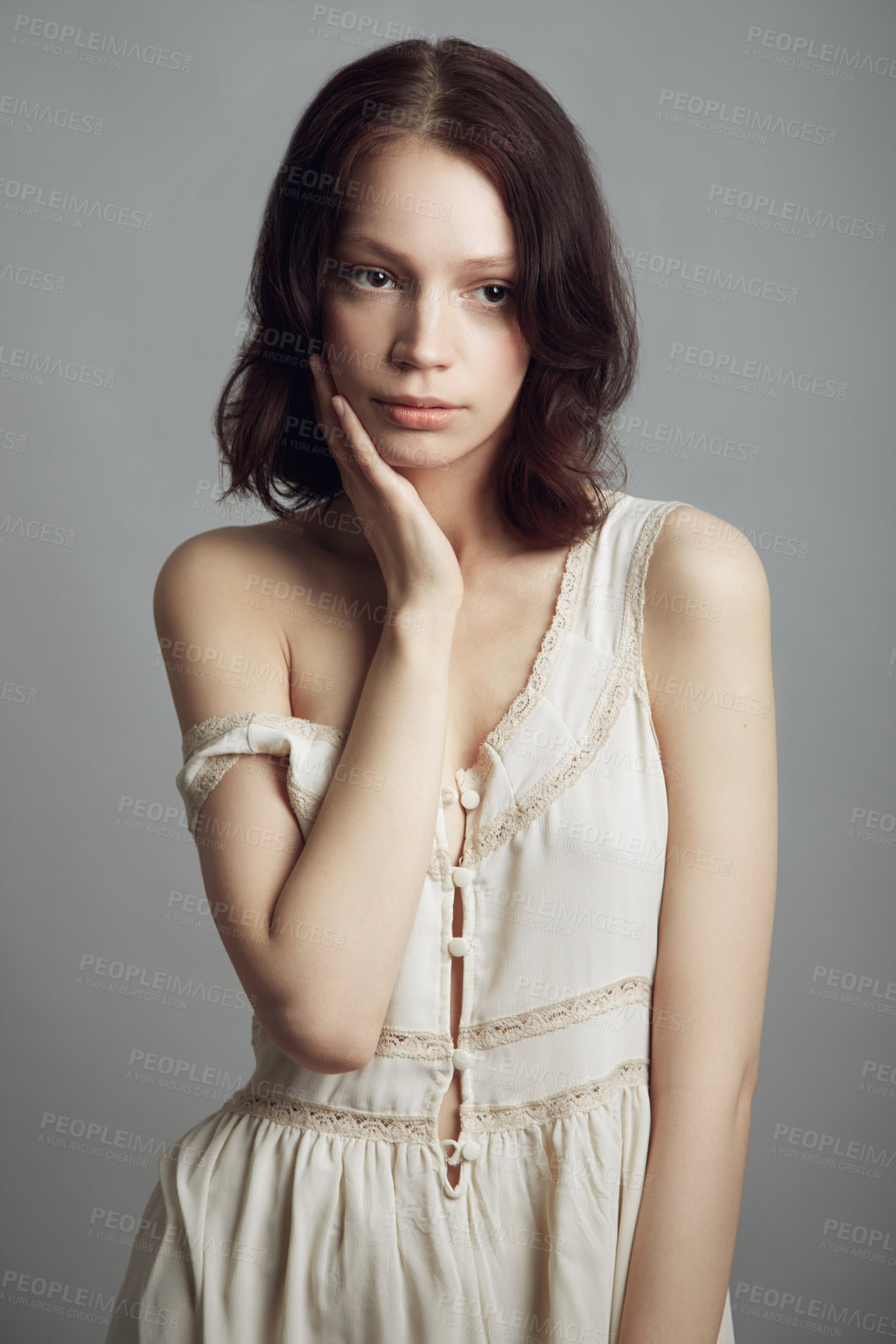 Buy stock photo Portrait of a beautiful young woman wearing vintage clothing and posing with hand on her cheek
