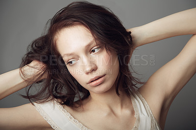Buy stock photo Sad, thinking and a woman with mental health problem isolated on a dark background in a studio. Idea, depression and a young girl or model with ideas, depressed and thoughts of anxiety on a backdrop