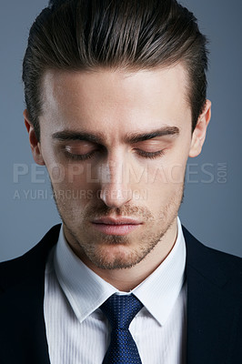 Buy stock photo Cropped shot of a handsome and fashionable young man posing in the studio